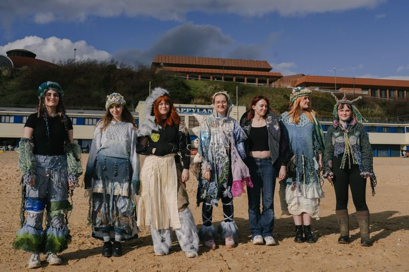 Group ensemble of final costumes.