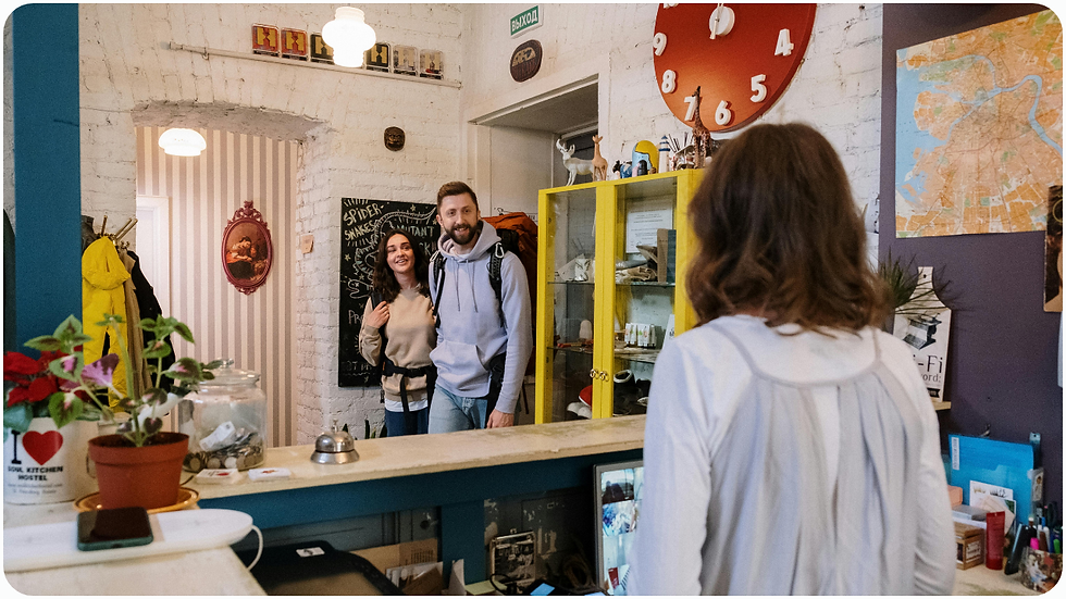 A backpacking couple walking happily into a tour operator's office, thanks to the fact the company adopted automation software for their travel company