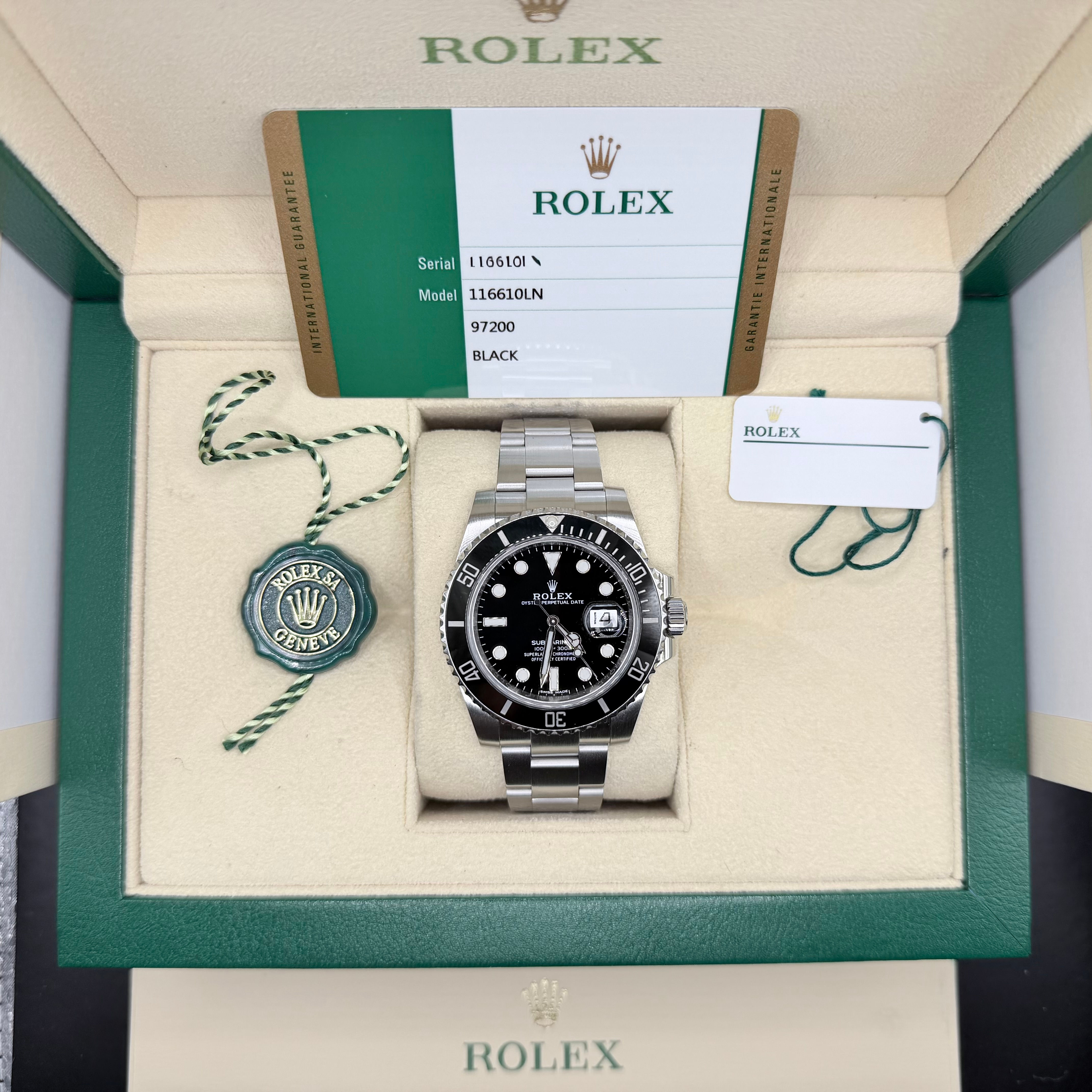 Rolex 2018 Submariner Date w/Box and Papers, green and white hangtag