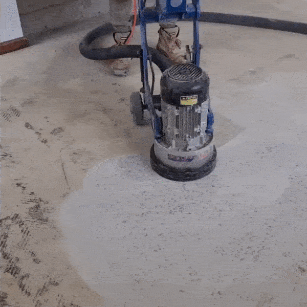 Concrete Surface Preperation using mechanical grinder to create a surface profile so that epoxy coatings adhere to the concrete preventing it from debonding