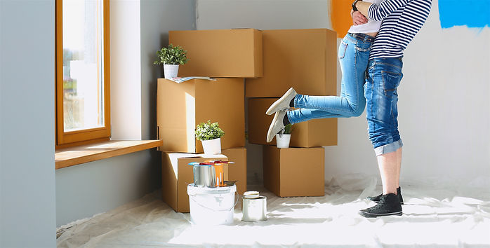 Happy young couple moving in new house.jpg