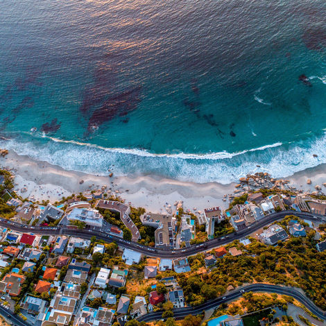 An aerial photograph showcasing the crystal blue waters of Clifton, Cape Town, South Africa.