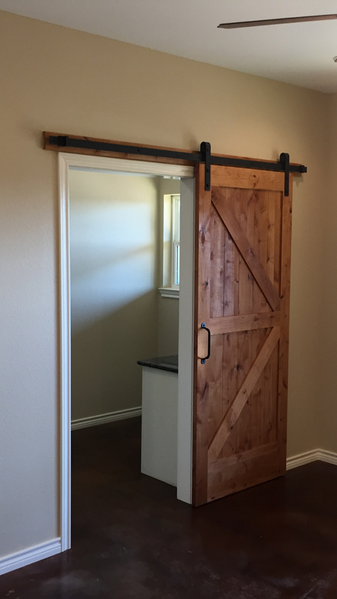Harvey Family - Barn Doors In Master Bedroom