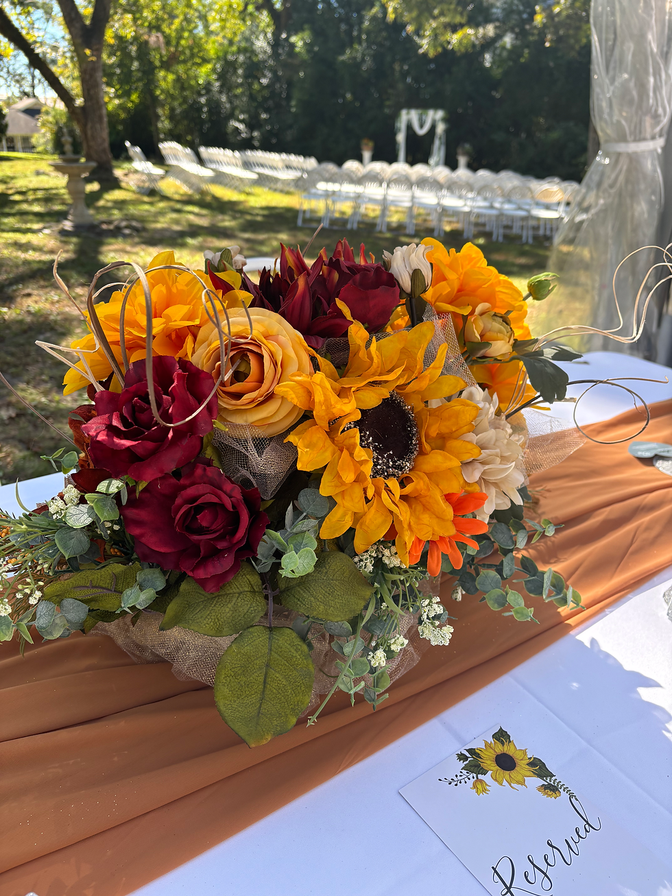 Sunflower table arrangement for a fall wedding at mistletoe bough bed and breakfast, a lake Martin wedding venue.
