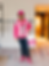 Alejandro Caraballo, Founder of Dream Team Finishes, a Chattanooga, Tennessee commercial finishing company, standing on-site at Caption by Hyatt Chattanooga wearing a pink hard hat and safety vest while holding a bucket of Dream Cream, his proprietary commercial paint product made in Tennessee.