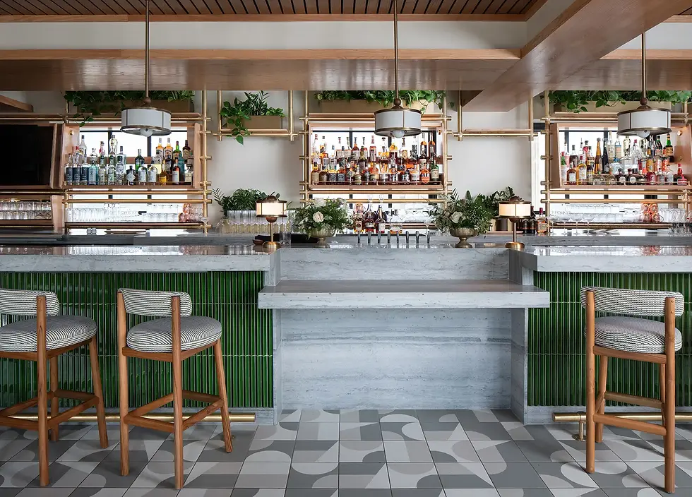 Where the bar meets the mural — precision cuts around custom millwork and electrical components keep the artwork uninterrupted at the Iris Rooftop Bar, Chattanooga, TN, by Dream Team Finishes