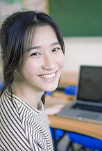 Smiling Student Sitting At Desk_edited.jpg