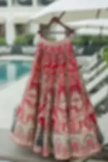 A red lehenga with embroidered royal motifs