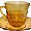 Miniatura: Preloved Vintage amber coloured glass cup and saucer, made in France