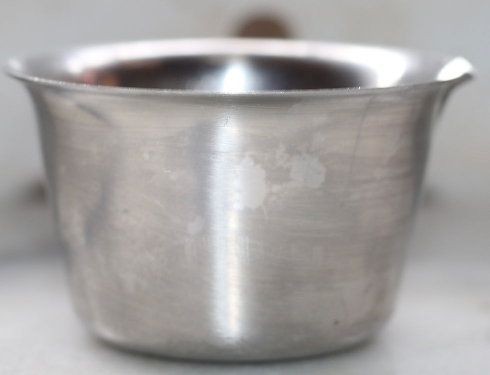 Thumbnail: vintage stainless steel melting pot features a wooden handle and a pour spout.