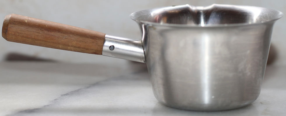 Thumbnail: vintage stainless steel melting pot features a wooden handle and a pour spout.