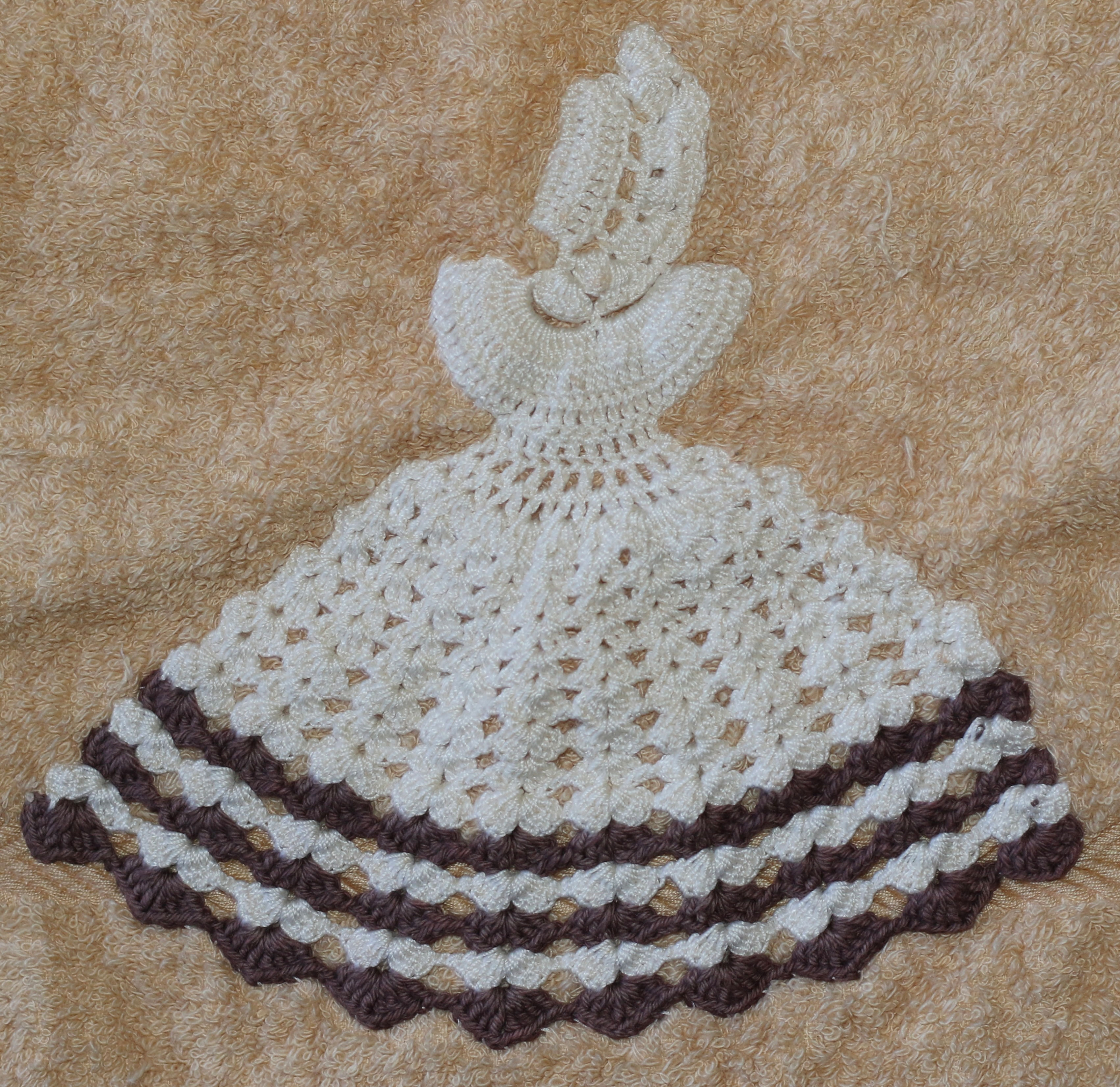 Vintage-style hand towel decorated with a crochet crinoline lady motif