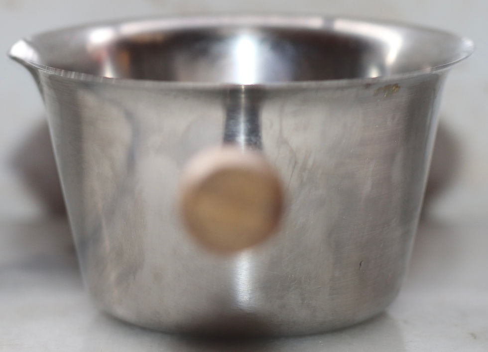 Thumbnail: vintage stainless steel melting pot features a wooden handle and a pour spout.