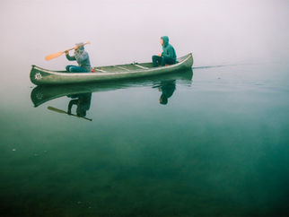 People rowing in a canoe
