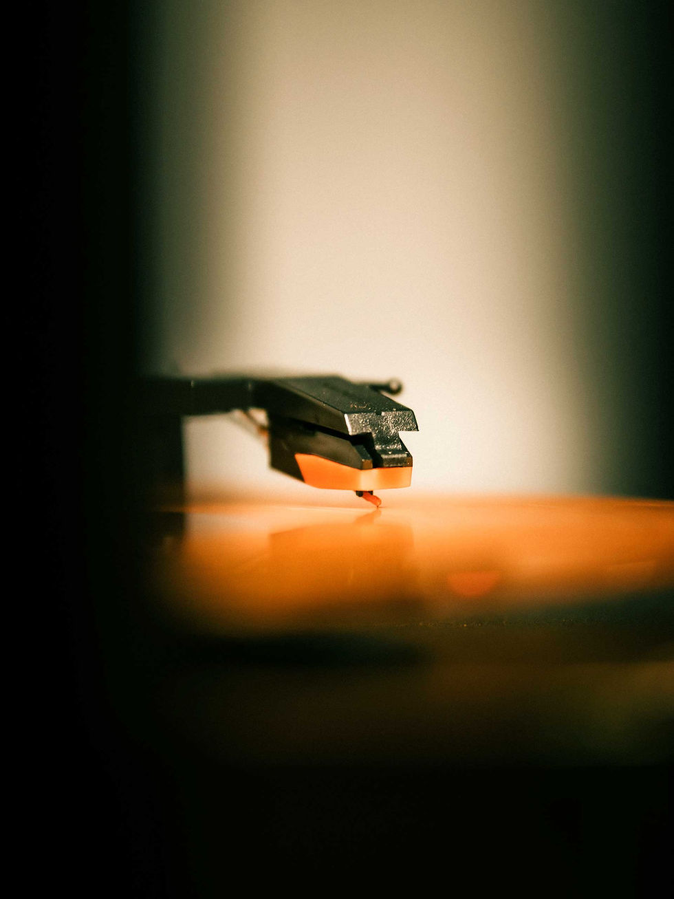 Close-up of a vinyl record player needle symbolising analogue listening and vinyl resurgence