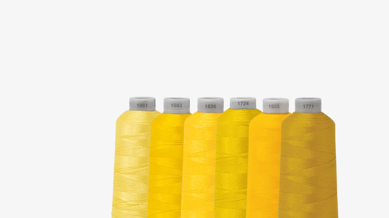 Bobine de fils de couleurs Jaune pour montrer au clients - Broderie Paris 