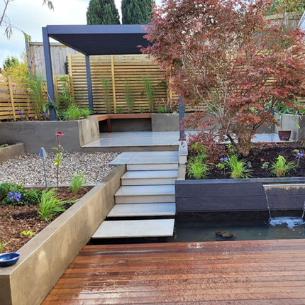 garden design by Nuttgens Garden Design in Downend Bristol with water feature and pergola 