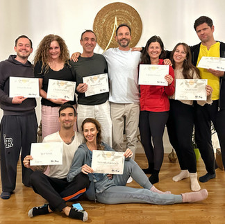 A group of graduates from the Somagetic Practitioner Training in Vienna, Austria, holding their certificates.