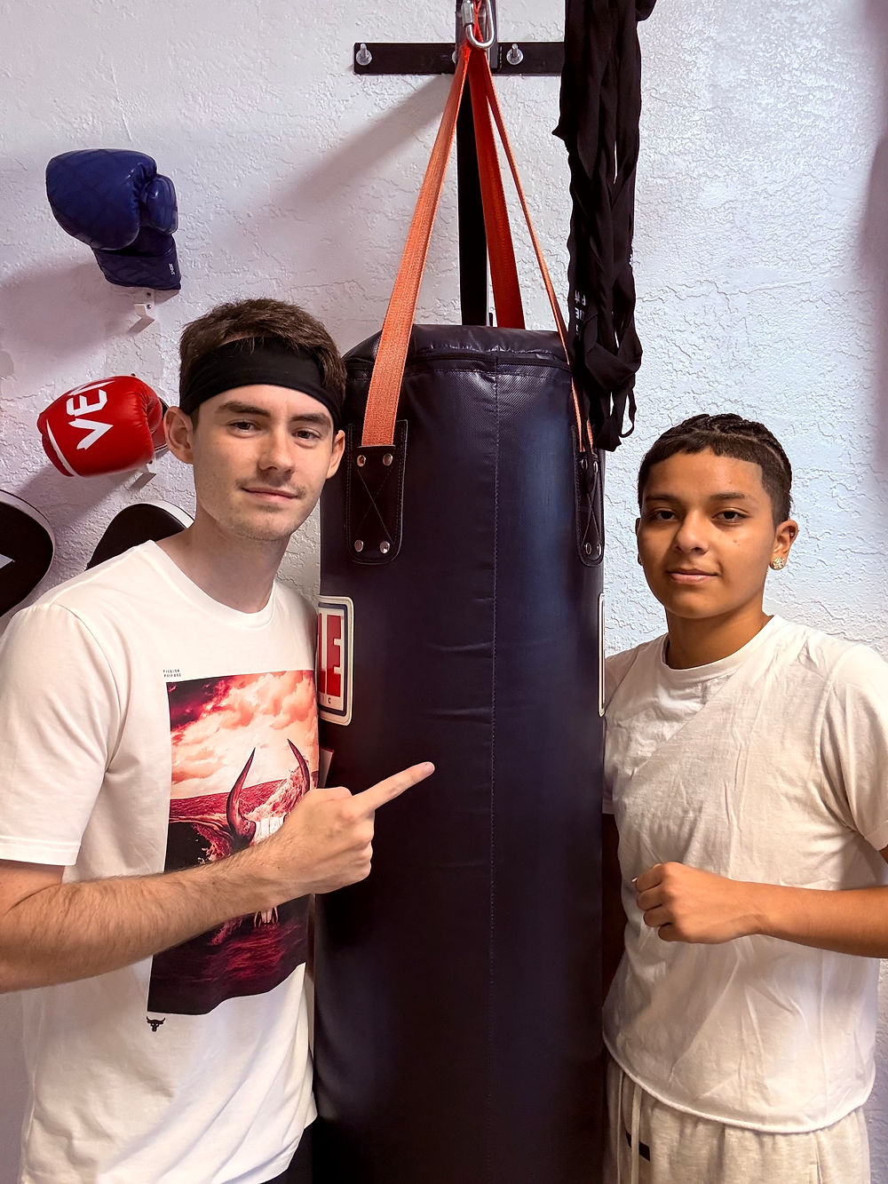 Two youth athletes at a private coaching boxing session.