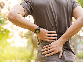 Back Pain Man Holding His Back.jpeg