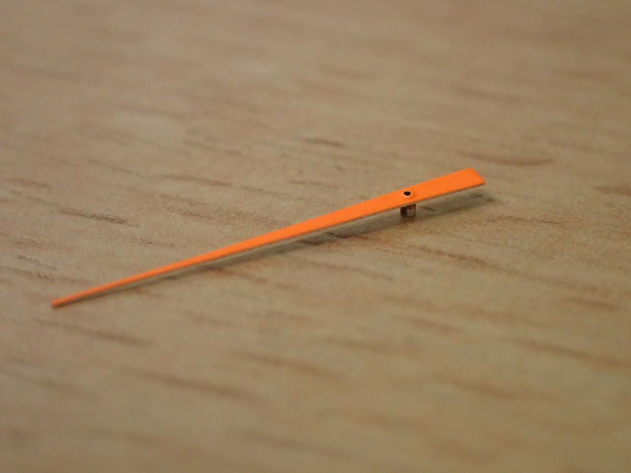 Central seconds hand in bright orange.