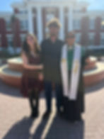 Wedding officiant with couple at outdoor ceremony site