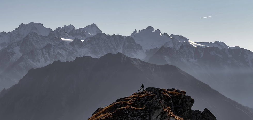 Haute-Route E-MTB rider pausing in front of the Mont-Blanc Massif