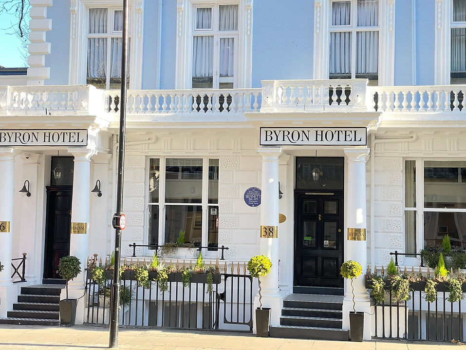 Exterior view of The Byron Hotel, a stylish boutique hotel in Kensington, featuring classic architecture