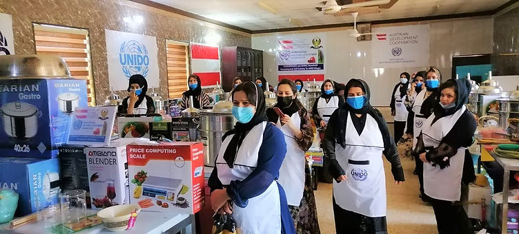 Beneficiaries with their set of pomegranate processing equipment and tools.jpg