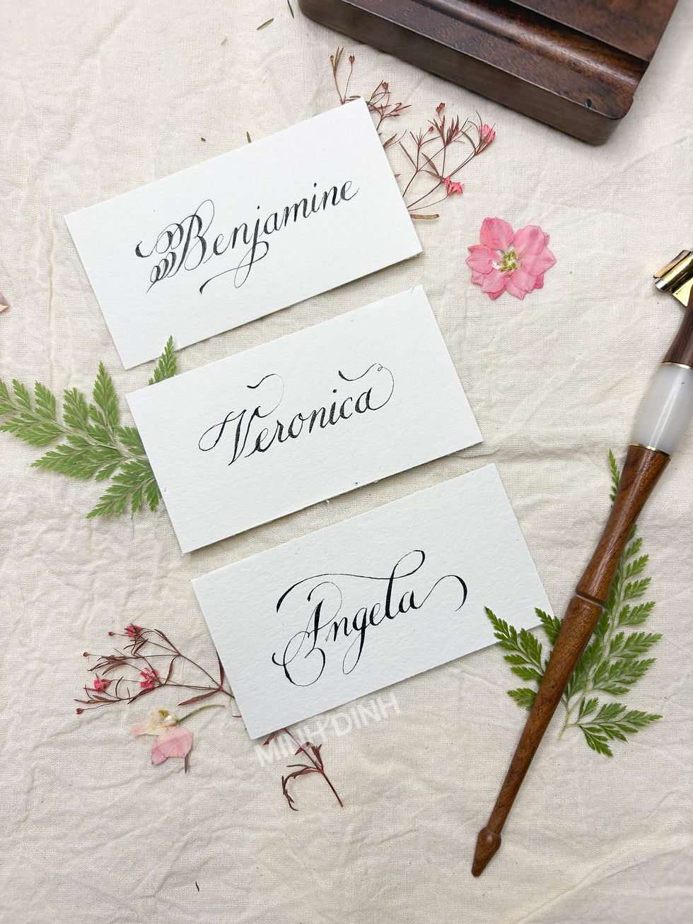 Minh Dinh, Dallas Calligrapher's work featuring name plate.
