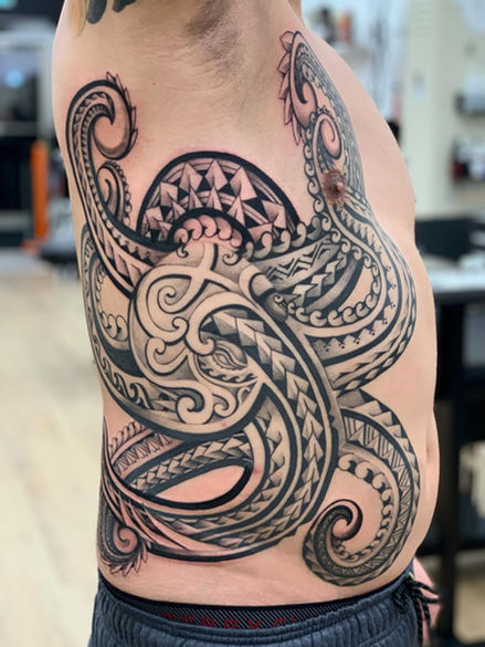 full rib tattoo of polynesian octopus