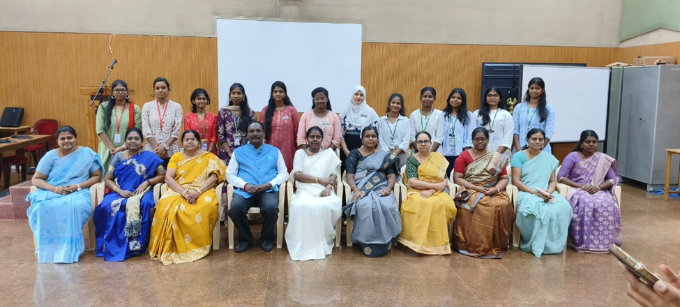 Guest speaker and faculty of the Chemistry Department seated, with club office bearers standing behind (Credits: Charmini. N. K, III B.Sc. Chemistry)