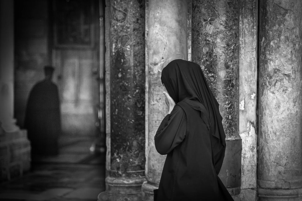 lady in black praying 