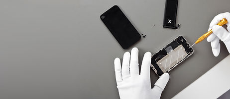 Person fixing a phone.