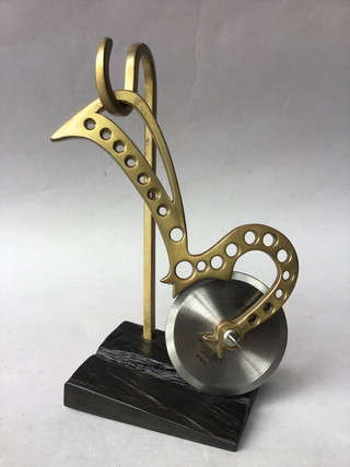 Unique pizza cutter, handmade frame of pierced brass with Stainless Steel blade on ebony stand. Allegedly from the wreckage of the Air ship Italia. 1928