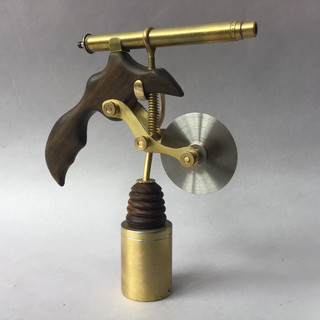 Handmade pizza cutter: rosewood handle, brass cutter frame & laser tube projects cutting guide line; cylindrical brass stand. 1917