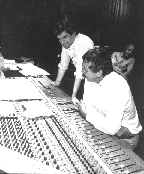 Clive Green and Adrian Kerridge leaning over a Cadac mixing console.