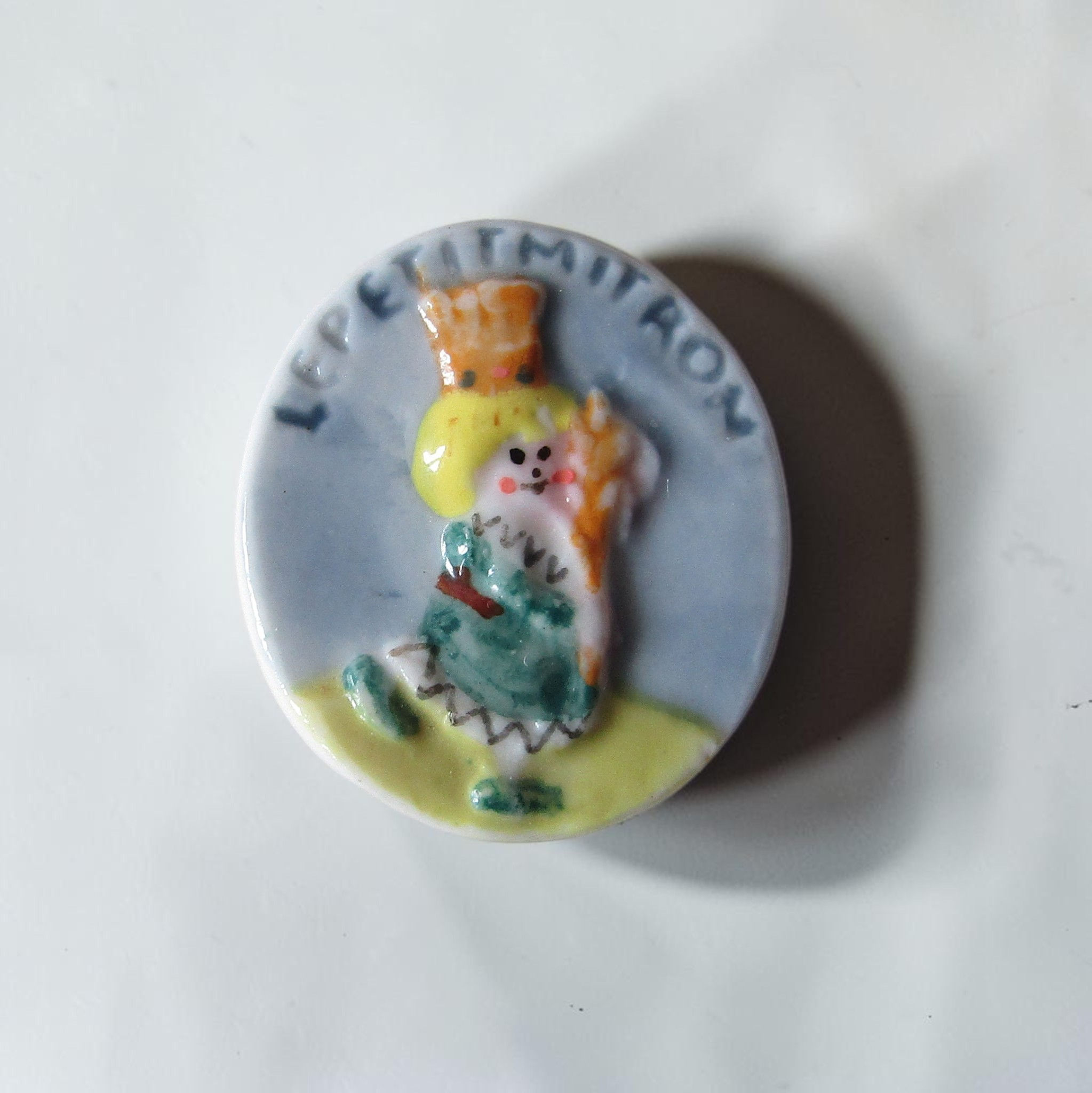 Fèves brillantes en porcelaine de la série « Le Petit Mitron et la Galette magique », éditée par les Éditions Prime en 1995.