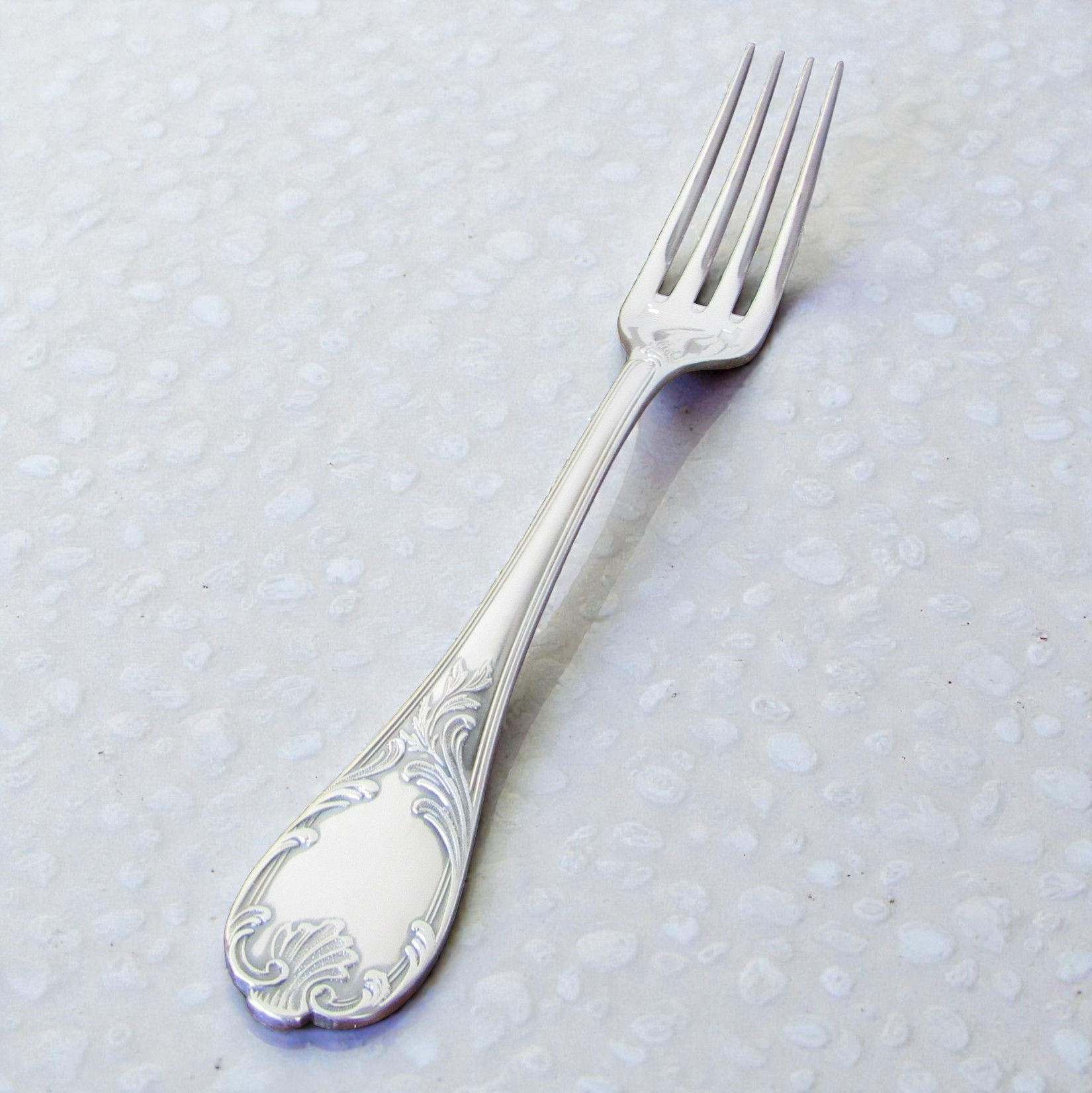 Couvert de table Christofle modèle Marly en métal argenté, composé d’une fourchette de 20,5 cm, d’une cuillère de 17 cm