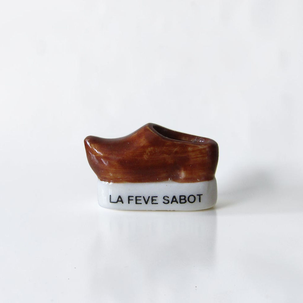 Miniature : Série de 12 fèves brillantes en porcelaine « Les fèves des origines à nos jours » éditée par Prime en 2000, représentant la