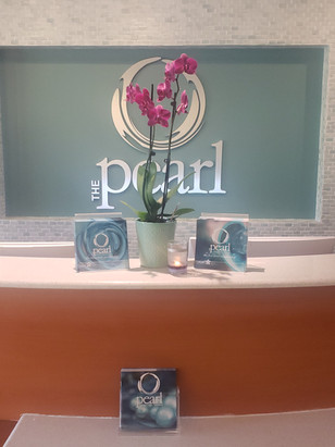 Orchid and Pearl Spa logo;pamphlets on counter