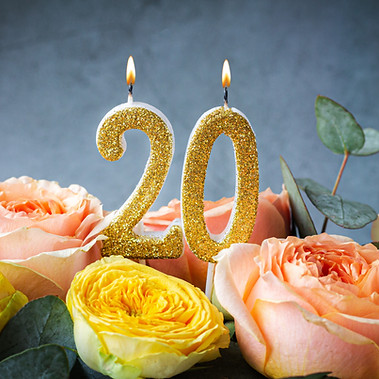 Gold glitter number 20 celebration candle with flowers.jpg