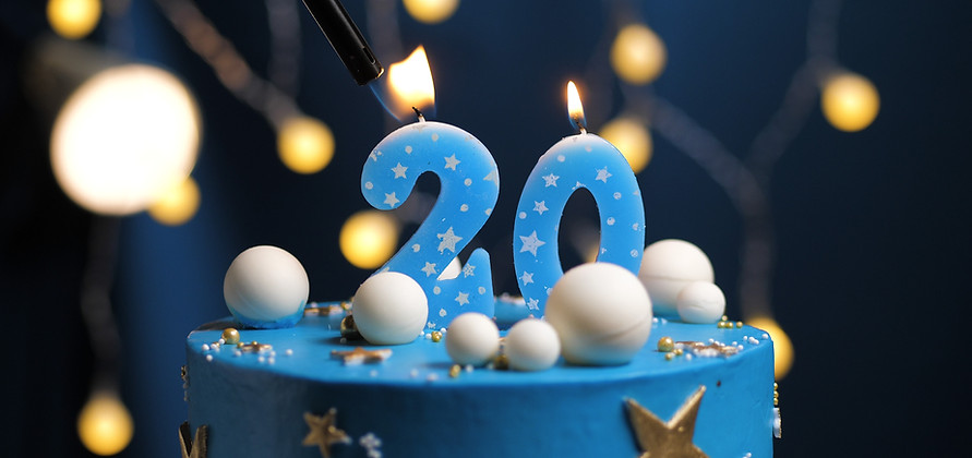 Birthday cake number 20 stars sky and moon concept, blue candle is fire by lighter Copyspa