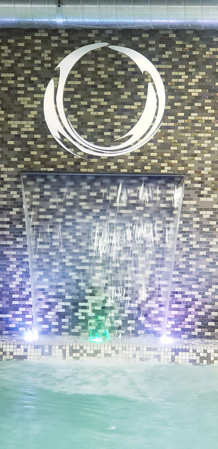 Illuminated water feature with 'O' logo: the-pearl-spa