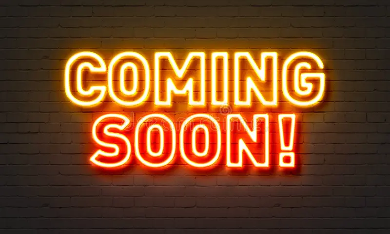 coming-soon-neon-sign-brick-wall-background-87865865