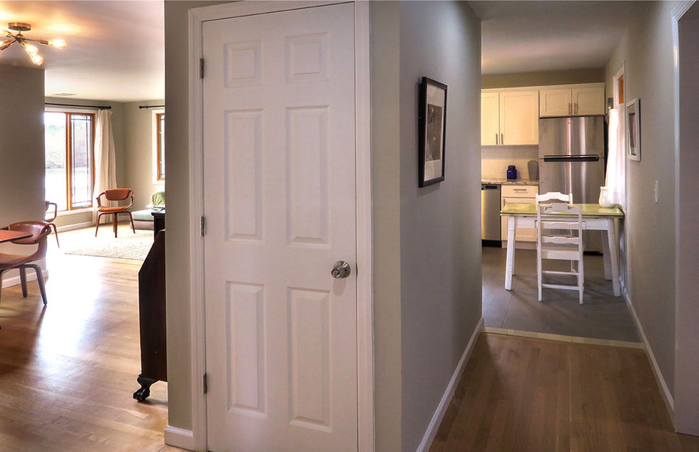 Stairs behind door to Lower Level
