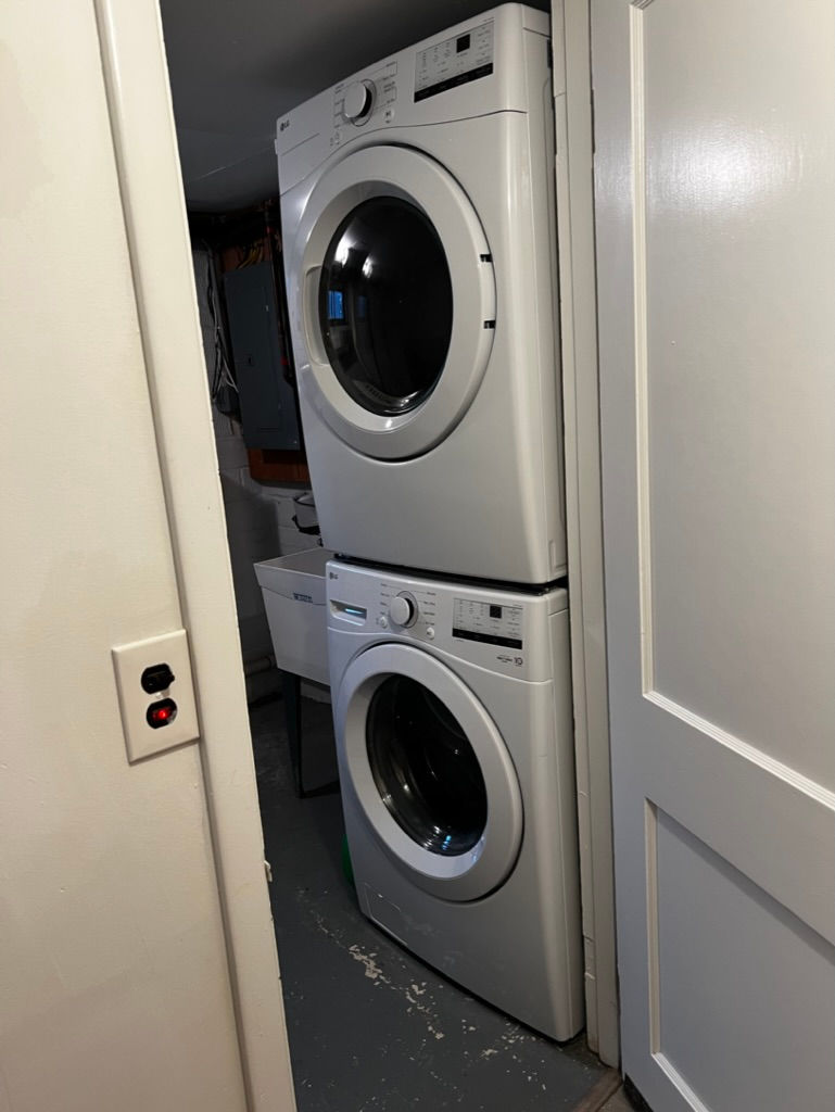 New washer-dryer in laundry room.