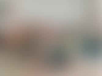 Children and two adults play joyfully in a playroom. Kids wear colorful clothes, and a speech bubble on the wall reads, "I am not young enough to know everything."