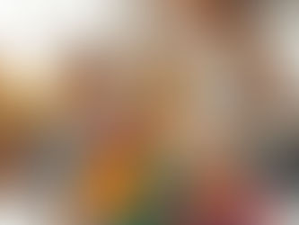 Woman works on laptop with charts, while child draws with colorful pencils. Bright room with plants and books. Cozy and focused mood.