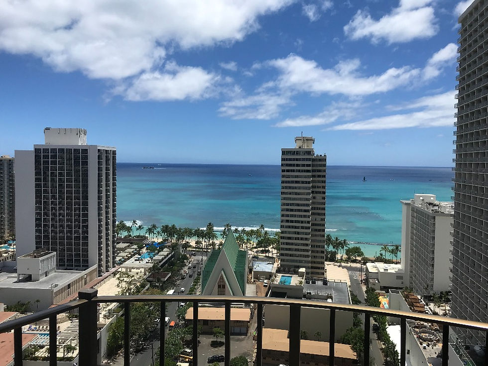 View from the balcony of a high rise hotel looking towards Waikiki beach